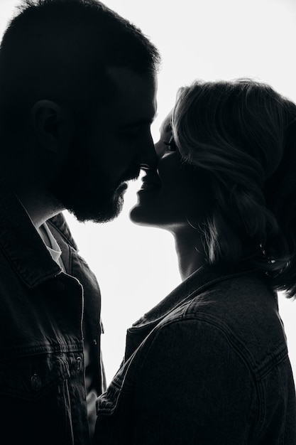 Couple kissing in the night silhouette of a coupleportrait of a couple