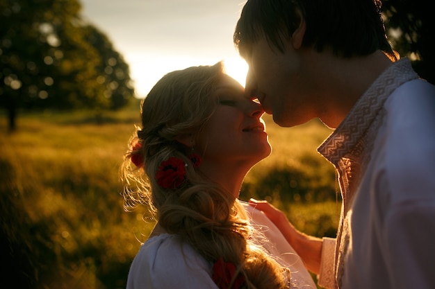 Couple kissing on the sunset