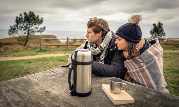 Couple looking away on field