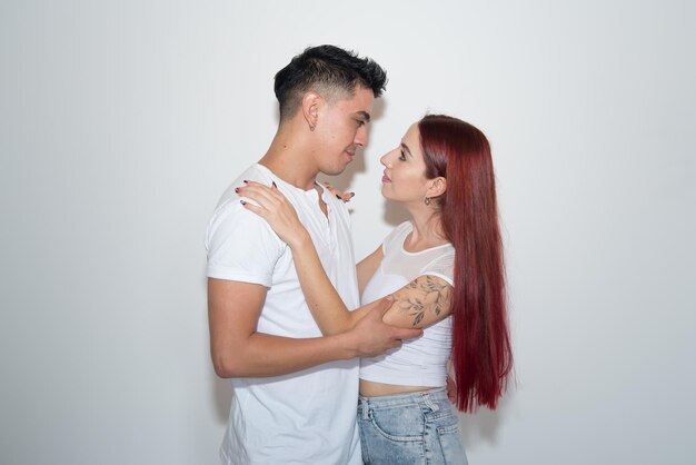 couple in love celebrating, latin man, redhead woman