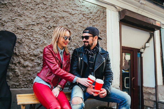 Couple in love drinking coffee in strret coffee shop