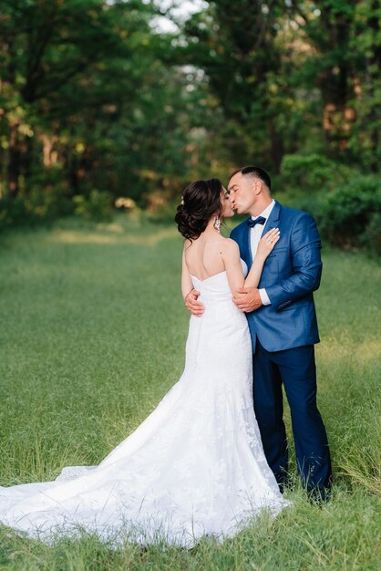 A couple in love a guy and a girl on a walk in the forest belt