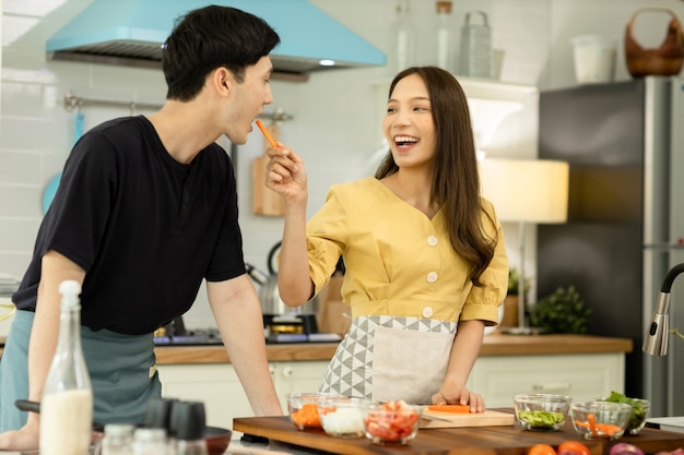 couple in love helping to cook In a romantic atmosphere