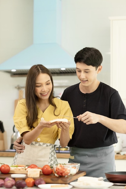 couple in love helping to cook In a romantic atmosphere