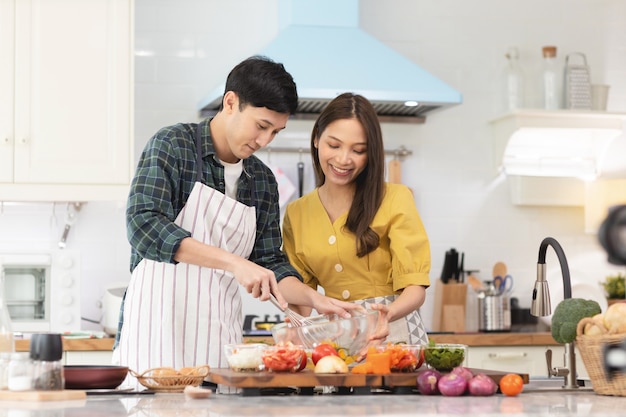 couple in love helping to cook In a romantic atmosphere