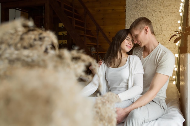 Couple in love hugs. man and woman smiling. Valentine's day