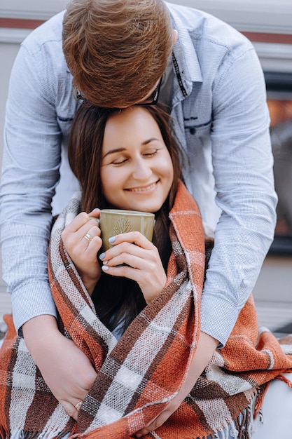 Couple in love living in trailer on camping and have fun and happy