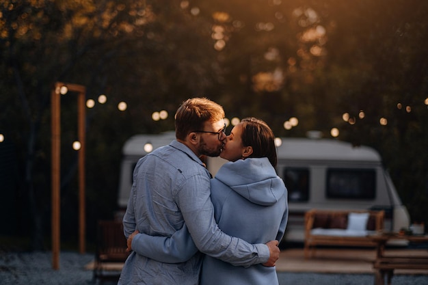 Couple in love living in trailer on camping and have fun and happy