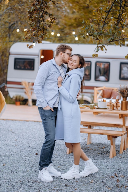 Couple in love living in trailer on camping and have fun and happy