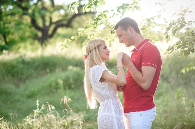 Couple in love at a picnic in a park with green grass