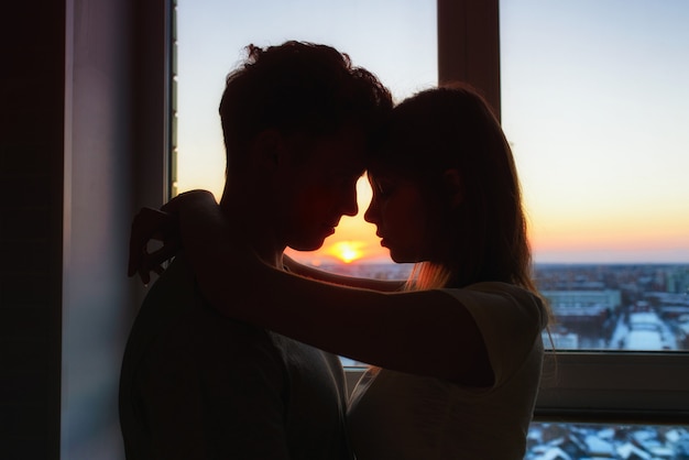 Couple in love, profile silhouettes close to each other