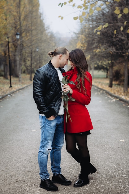 A couple in love on a romantic date in the autumn park