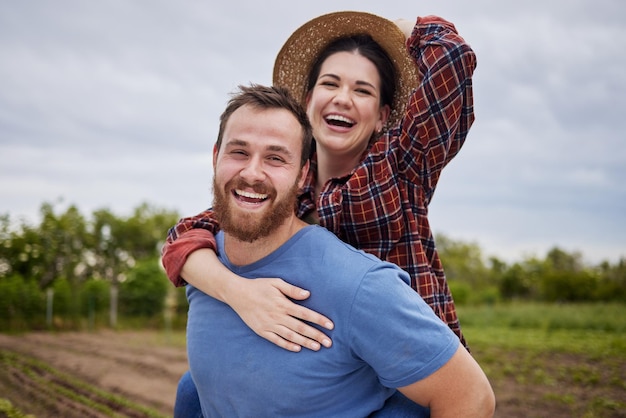 Couple love and sustainability with a man and woman together on a farm in the agriculture industry Portrait of a farmer working in a field for sustainable zero waste and eco friendly farming