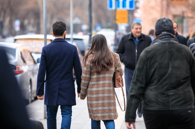 Couple of lovers walking hand in hand