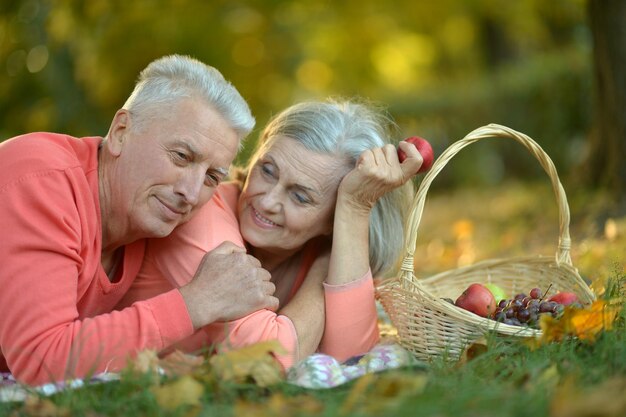 Couple lying in autumn park