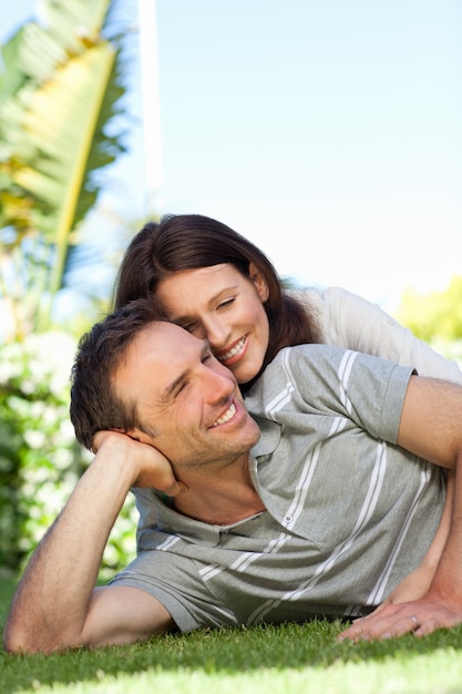 Couple lying down in the garden