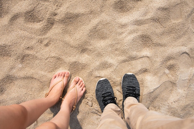 Couple man and woman standing on the beach