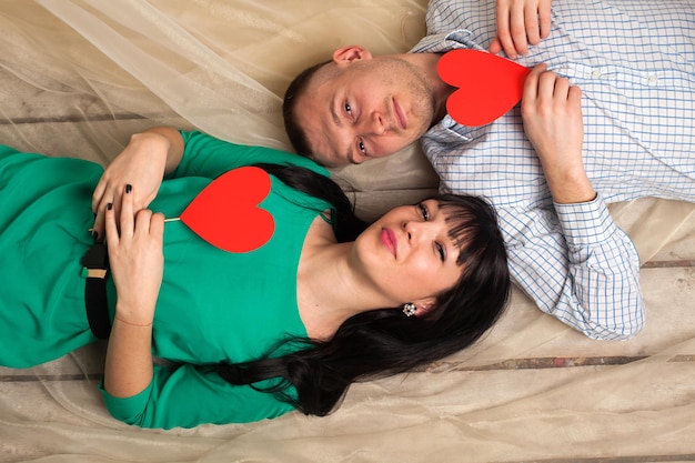 Couple of man and woman with shape of red heart. Love in Valentine's day.