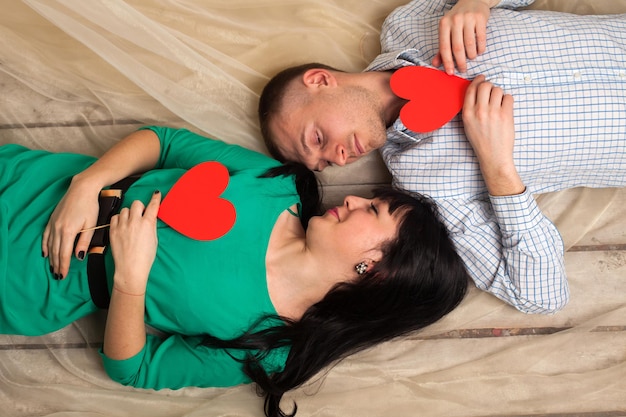 Couple of man and woman with shape of red heart. Love in Valentine's day.