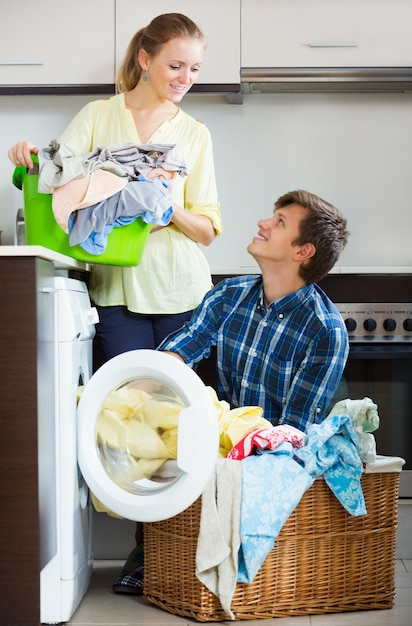 couple near washing machine