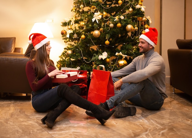 Couple opening a Christmas gift