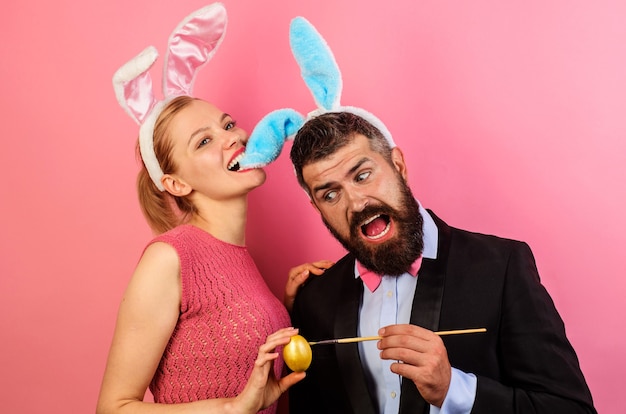 Couple painting eggs for Easter. Family celebrate Easter.