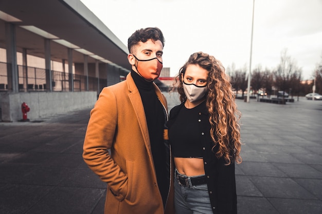 A couple posing at the street with casual clothes