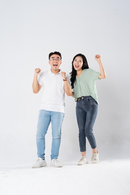 a couple posing on a white background