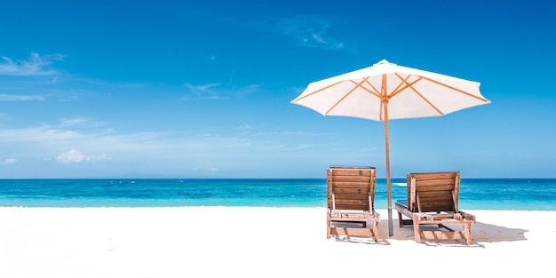 Couple Relaxing in Deck Chairs on Tropical Beach