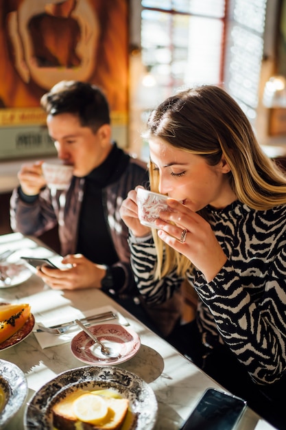 Couple in restaurant having breakfast.