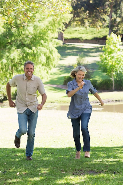 Couple running in park