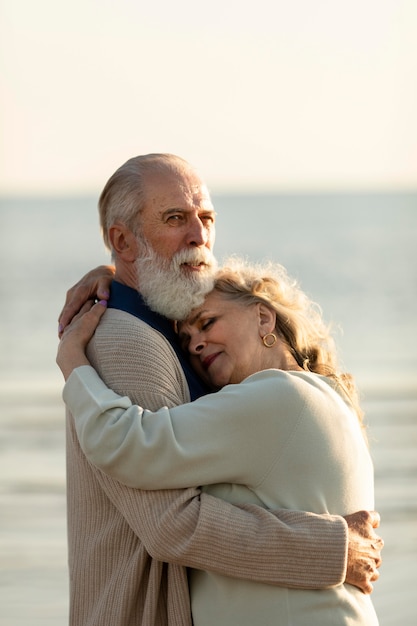 Couple at seaside hugging