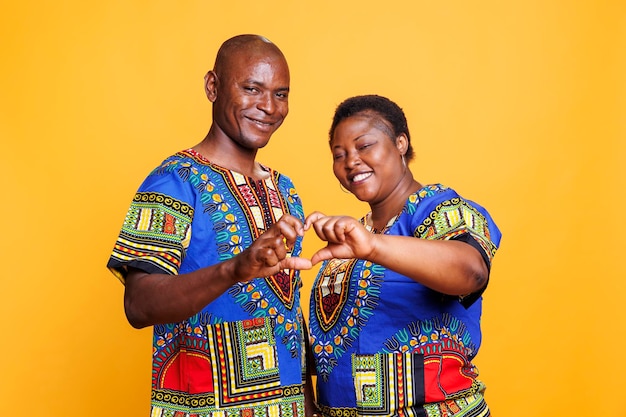 Photo couple showing heart shape with fingers