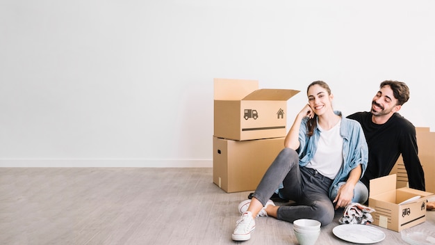 Couple sitting on floor in new flat