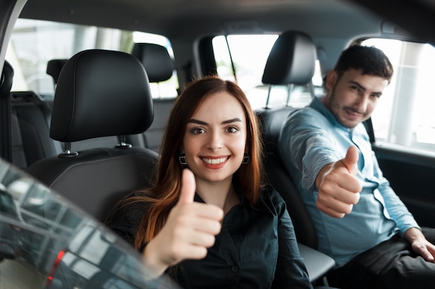 couple sitting in their new car