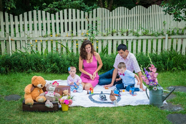 A couple sitting with the children