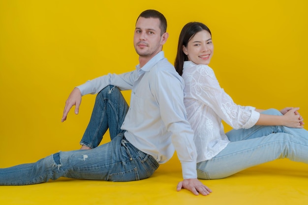 Couple smiling and sitting together on floor