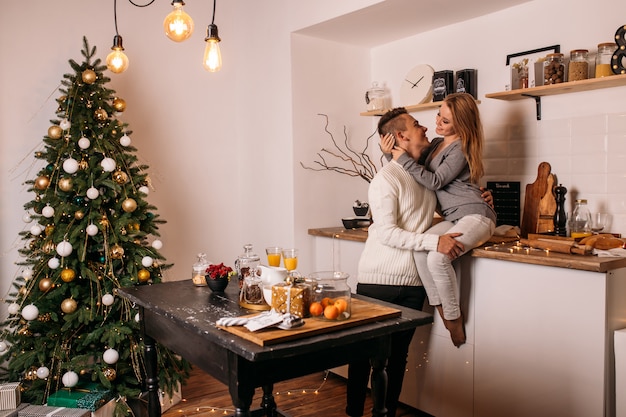 Couple spend their time together at home in the kitchen