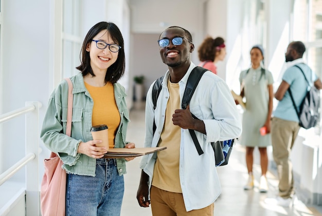 Couple of students standing at corridor