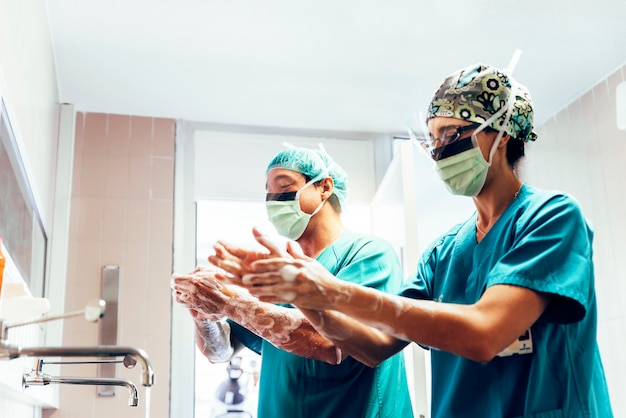 Couple of Surgeons Washing Hands Before Operating.