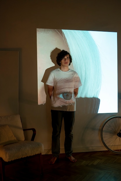 Couple taking photos in the light of movie projector