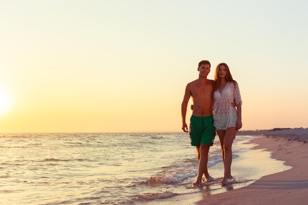 Couple taking a walk on the beach