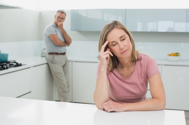 Couple not talking after an argument in kitchen