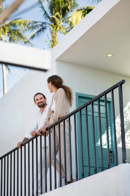 Couple talking on the balcony during vacation