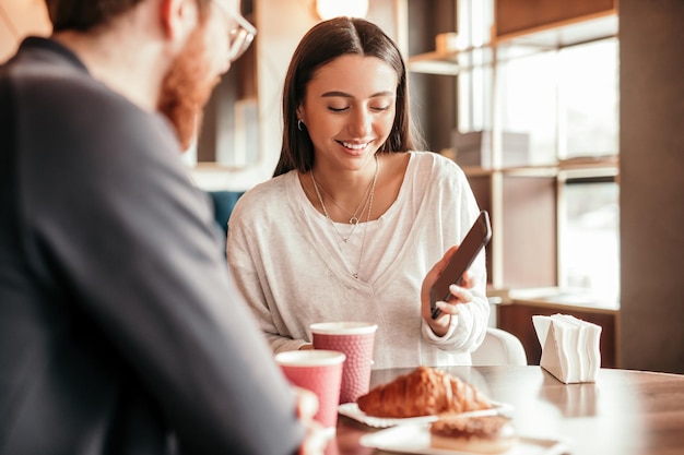 Couple using smartphone during date