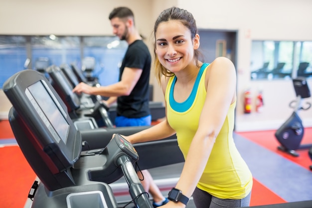 Couple using treadmills together