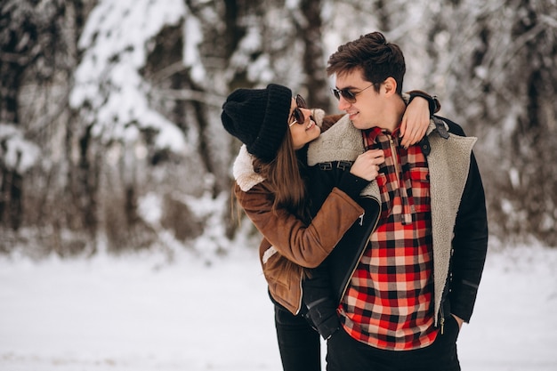 Couple on valentine's day in winter forest