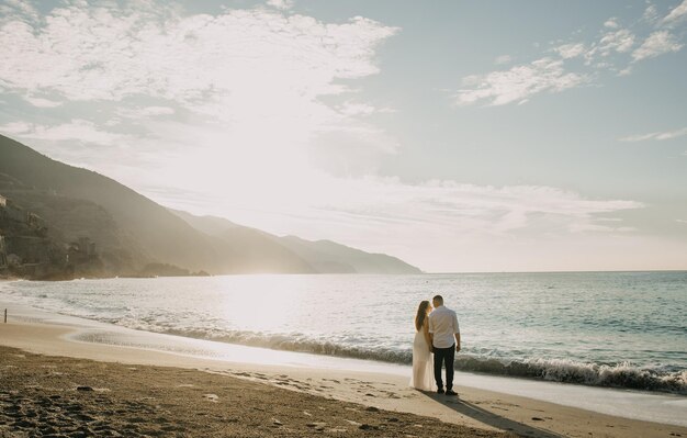 A couple walk on a beach in costa rica