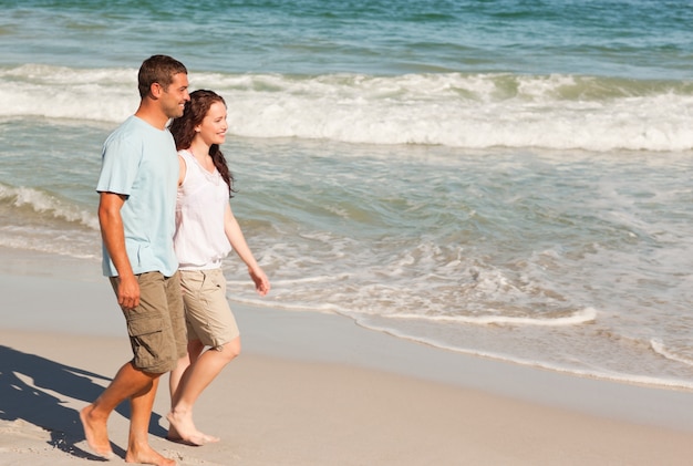 Couple walking on the beach