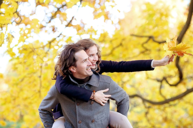 Couple with autumn leaves